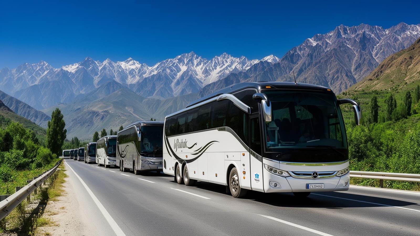 Convoy of charter buses driving on a mountain road in Pakistan